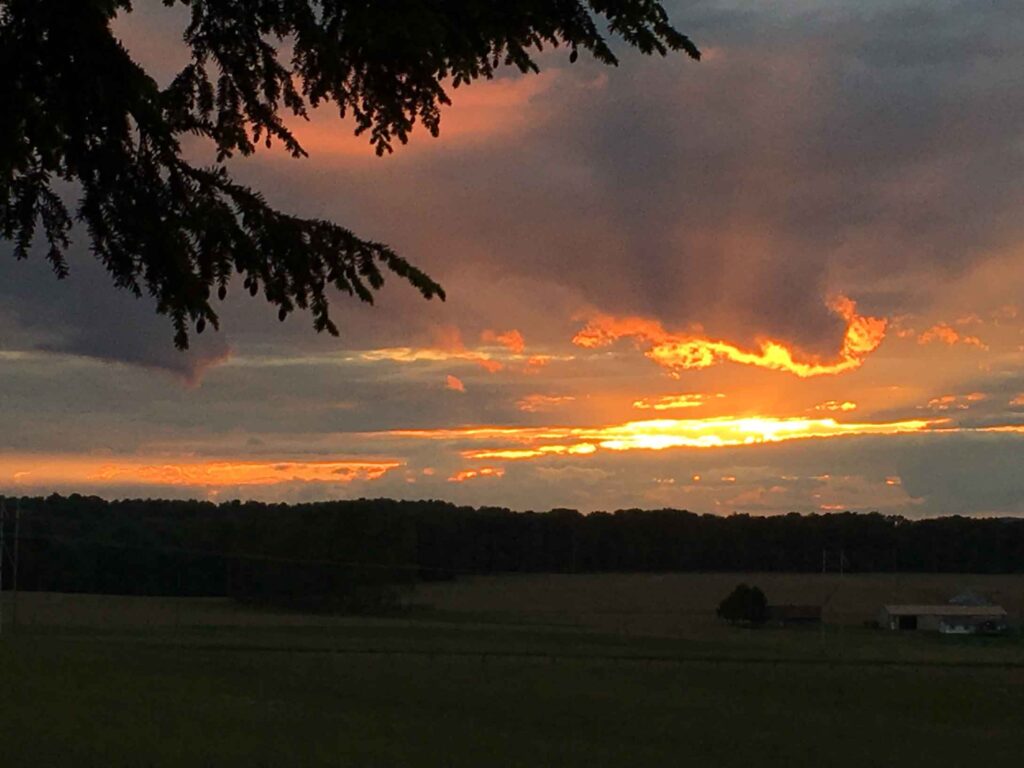 sunset over farm land