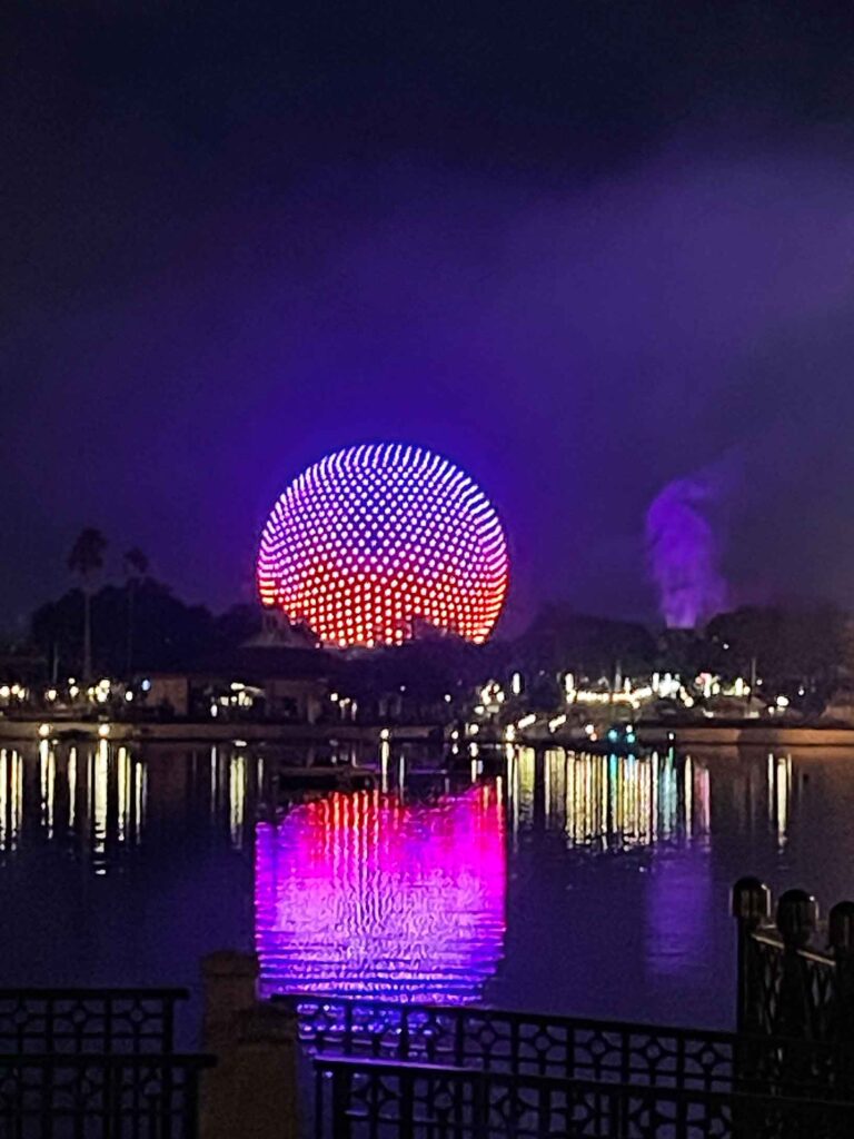 epcot ball lit up at night