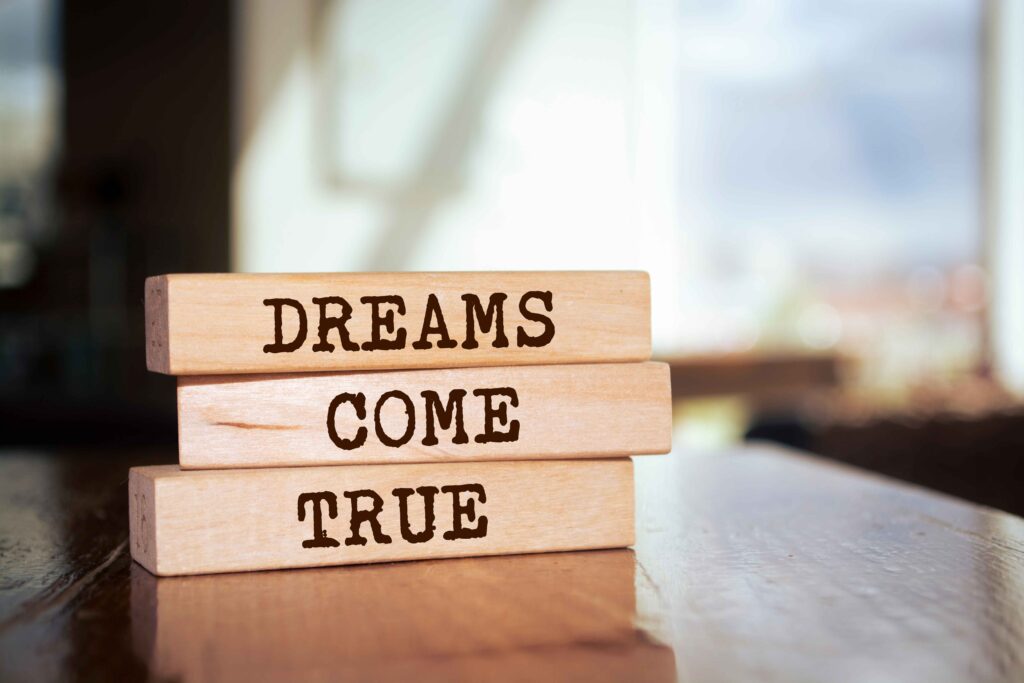 blocks with words that say dreams come true