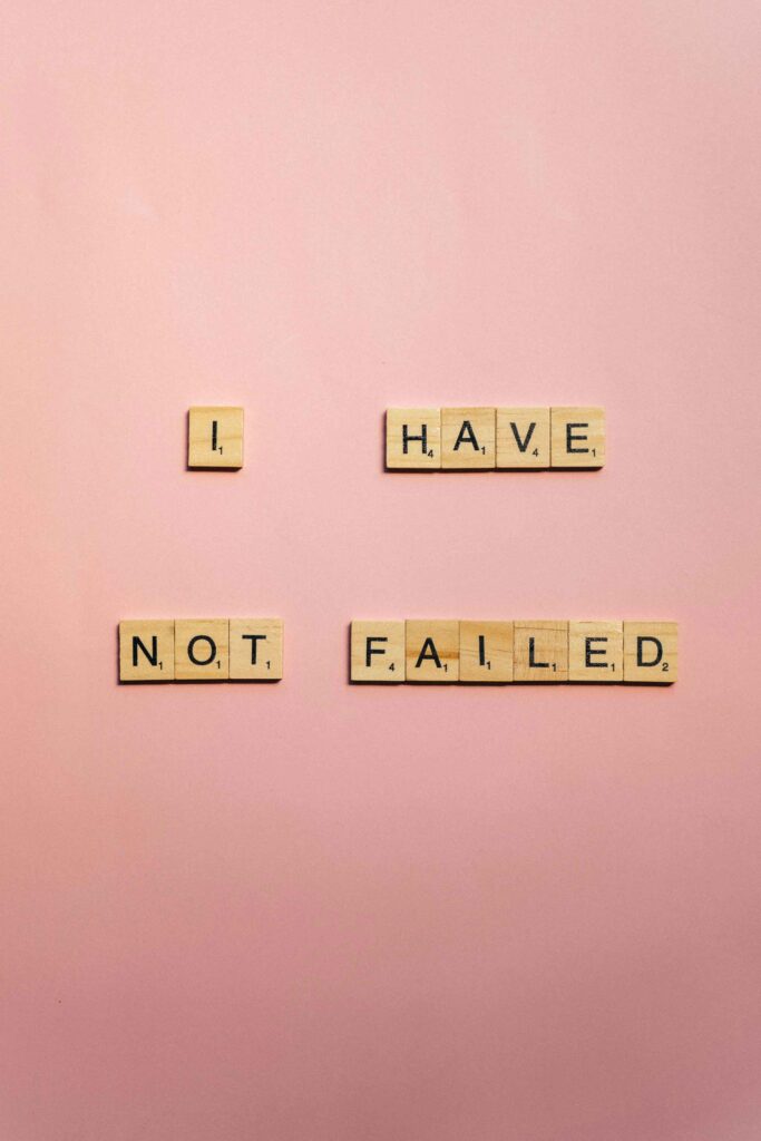 scrabble tiles on a pink background they say"I have not failed" think like a CEO