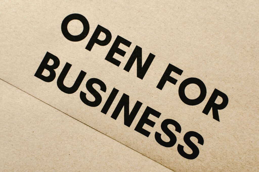 sign that says open for business - how to launch a business