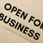 sign that says open for business - how to launch a business