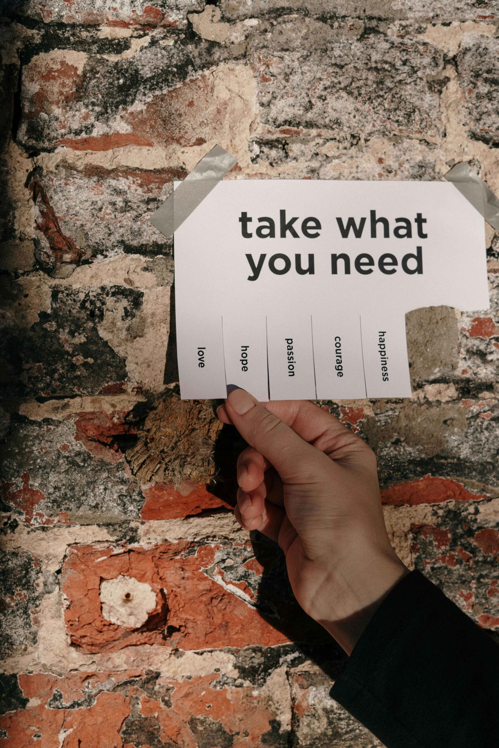 How to Deal With Naysayers as an Entrepreneur. Person Holding a Paper Taped on a Wall