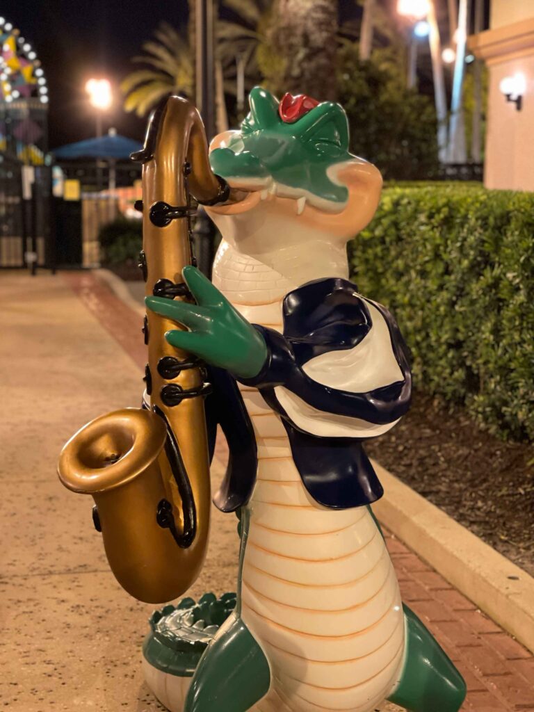 A crocodile playing the saxophone outside of Port Orleans resort in Disney Worlkd