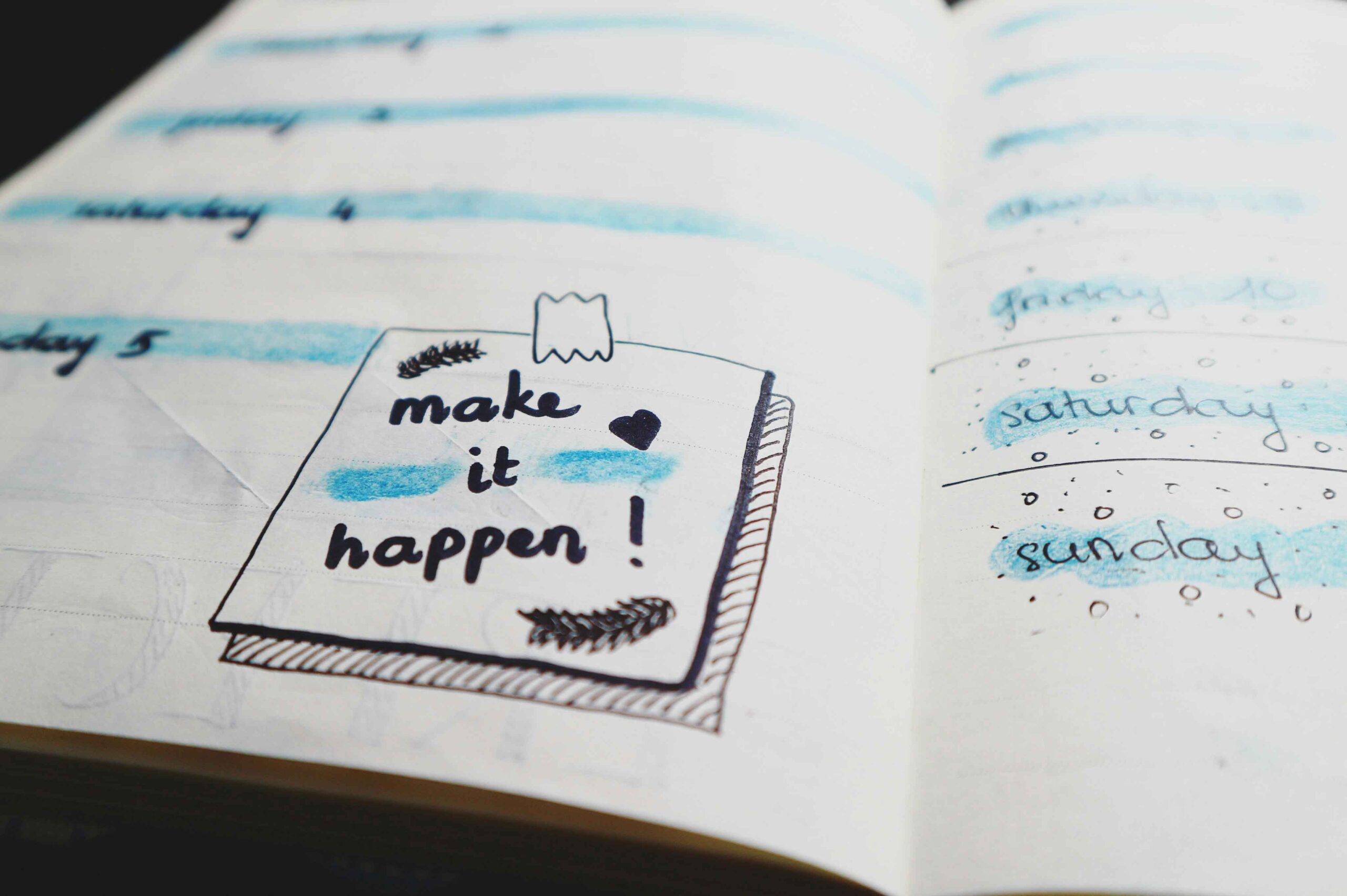 sticky note on a planner that says make it happen. visualization and goal setting for entrepreneurs