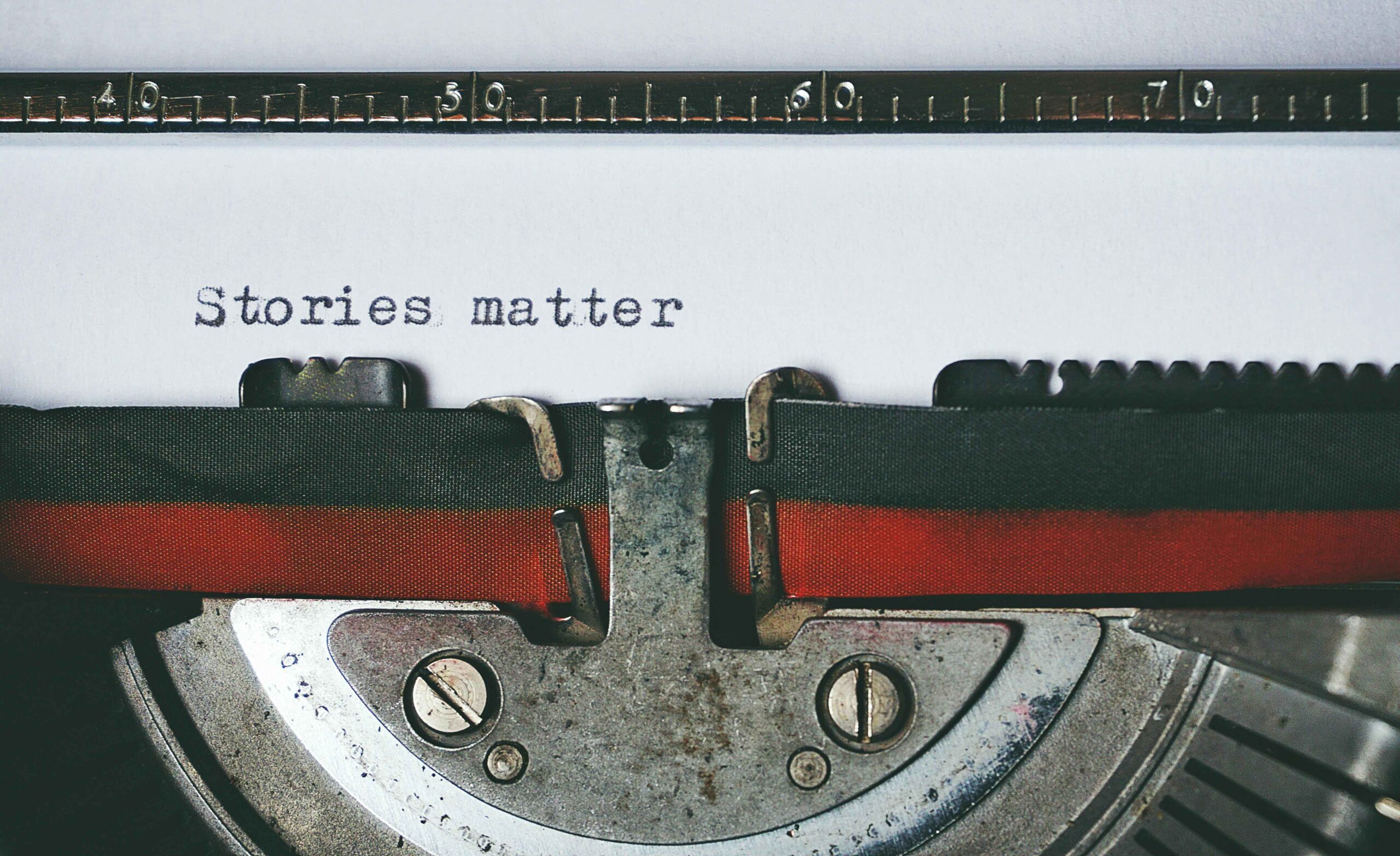 StoryBrand Method Transformed My Business - a photo of an old typewritter with the words types on white paper saying stories matter